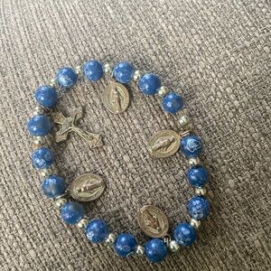 Blue bracelet with religious charms/symbols